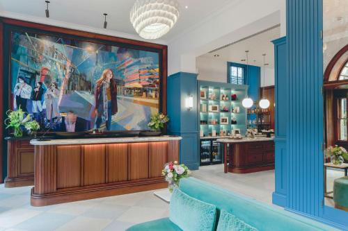 a barber shop with blue columns and a painting at Old Town Chambers, Autograph Collection in Edinburgh