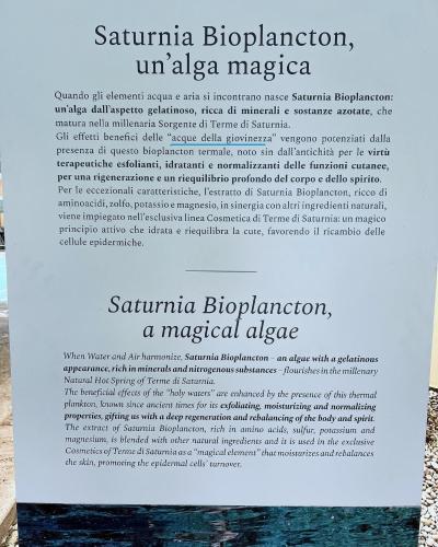 a sign for a museum in the water at Casale Terre Rosse in Saturnia