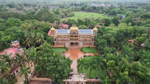 an aerial view of a building in a forest at Aayush Resort in Kālundri