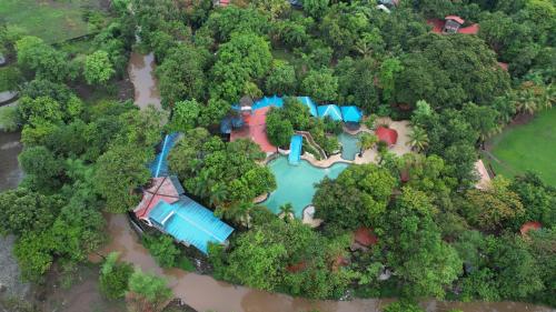 an aerial view of a house in the forest at Aayush Resort in Kālundri