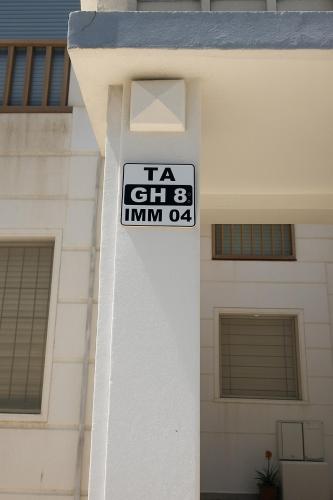 a sign on the side of a building at CHU -Family Apartment in Tangier in Daidatz