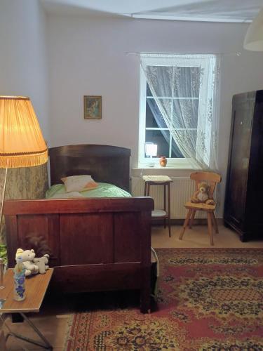 Postel nebo postele na pokoji v ubytování Dom przy lesie i jeziorze