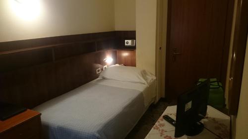 Una cama o camas en una habitación de Hotel Pescetto