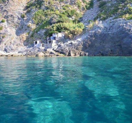 a large body of water next to a mountain at Gigi's guesthouse 1 in Manarola