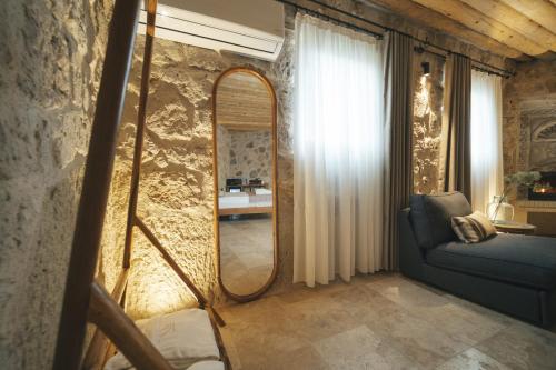 a living room with a mirror and a couch at Vie Cappadocia - Adults Only in Nevsehir