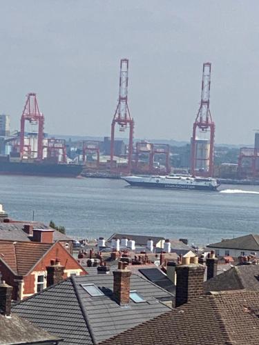 a view of a harbor with a ship in the water at Superior, spacious apartment in New Brighton, near Liverpool in New Brighton