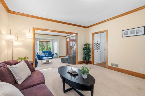 a living room with a couch and a table at Serenity on the Creek in Eden Prairie