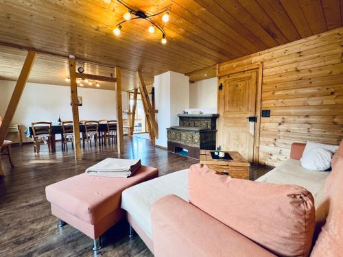 a living room with a couch and a table at Chalet Im Bätzenboden in Wengen