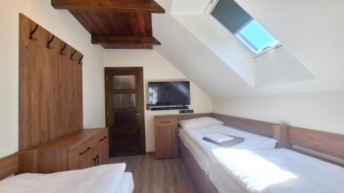 Postel nebo postele na pokoji v ubytování Villa Jizbička