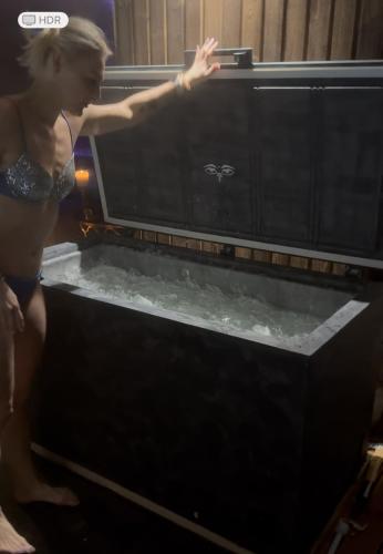 a woman is standing in front of a microwave at Harmony Resort & Spa in Padumble