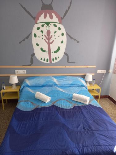 Ένα ή περισσότερα κρεβάτια σε δωμάτιο στο Casa de Amigos