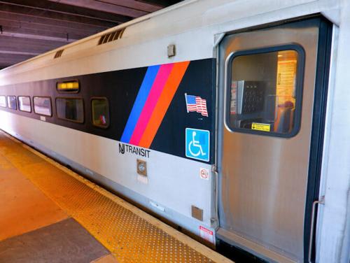 a subway train with a rainbow painted on the door at MOTELCASA Guest House Newark NJ in Newark