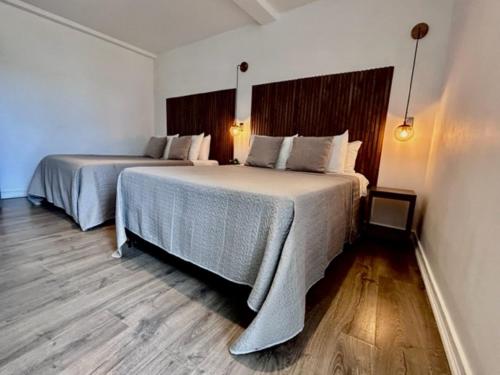 Katil atau katil-katil dalam bilik di Ataraxy Hotel Boutique