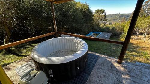 a large tub sitting on top of a porch at Peña de Horeb in Villa Serrana