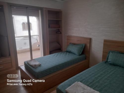 Katil atau katil-katil dalam bilik di Residence Aya Sidi Bouzid Marrequos