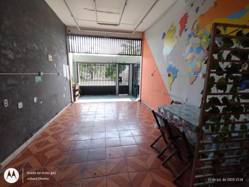a hallway with a room with a map on the wall at Duque HOSTEL in Belém