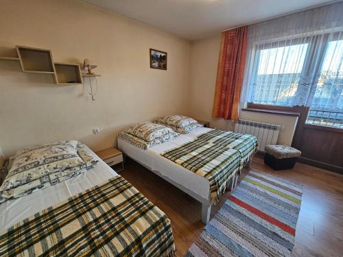 Postel nebo postele na pokoji v ubytování Pokoje Na Capówce