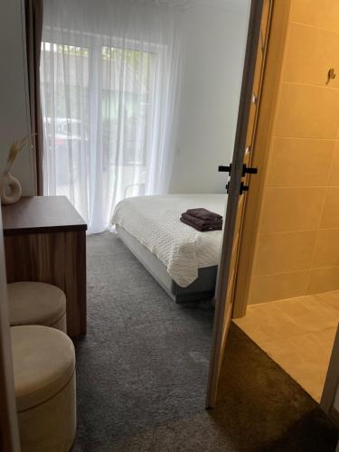 Katil atau katil-katil dalam bilik di Izabelės apartamentai