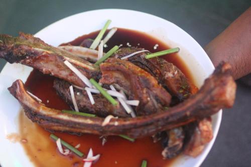 a bowl of food with meat in a sauce at Best Western Elyon Colombo in Colombo