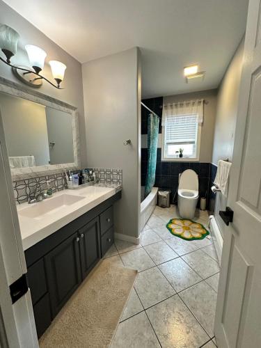 a bathroom with a sink and a toilet at 3-Bedroom Modern House in Halifax