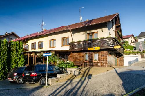 a black car parked in front of a house at R-Penzion in Český Krumlov