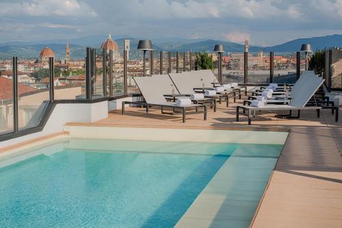 a swimming pool on the roof of a building at NH Firenze in Florence