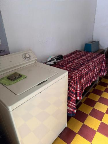 a small room with a table with a red and white table cloth at Casa colonial con encanto en Sonsón in Sonsón
