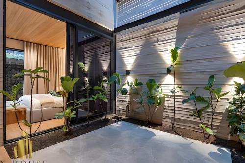 a room with plants on the side of a building at Casa Biflora - Natural luxury in top location in El Poblado