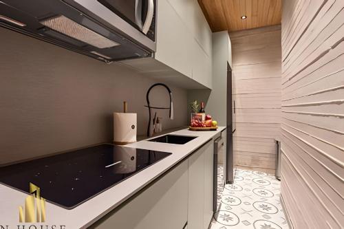 a kitchen with a sink and a counter top at Casa Biflora - Natural luxury in top location in El Poblado