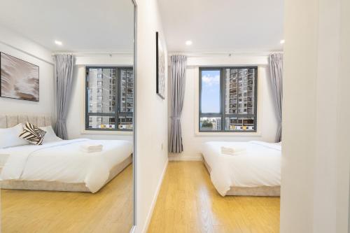 Postel nebo postele na pokoji v ubytování Masteri Residence Heera Stay Apartment