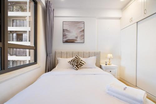 Postel nebo postele na pokoji v ubytování Masteri Residence Heera Stay Apartment