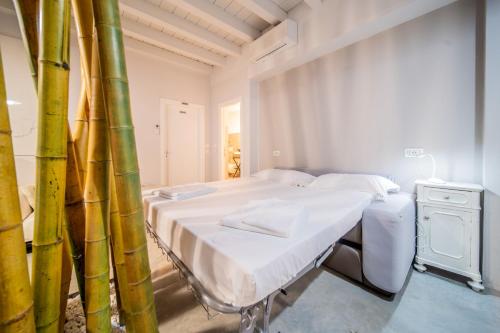 a hospital room with two beds and a bamboo wall at B&B Relax Rooms - Fiera Verona in Verona