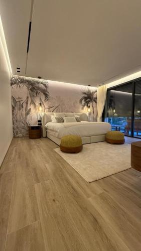 a bedroom with a large bed and a largeumedumed at Villa Talya in Marrakech