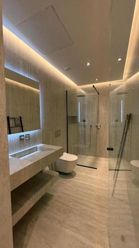 a bathroom with a toilet and a sink and a shower at Villa Talya in Marrakesh