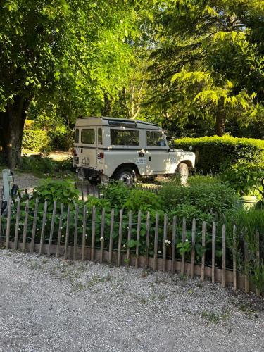 an old van parked next to a fence at Chateau d Artigues en Provence in Artigues