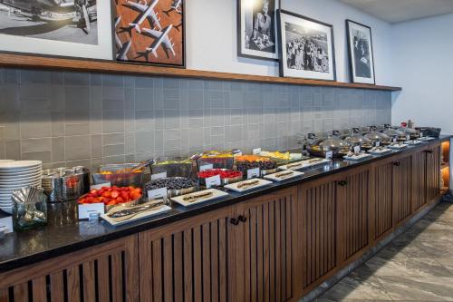 a buffet line with a lot of food at Hilton St. Louis Airport in Woodson Terrace