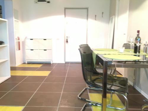 a kitchen with a table and a chair at New Central Roof top view in Bucharest