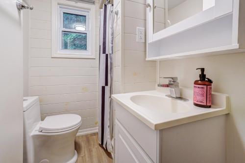 a small bathroom with a sink and a toilet at The Cozy Shore Cottage - Standard Single in Wasaga Beach