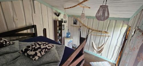 a bedroom with a bed and a mirror in it at Lighthouse Benki in Užava