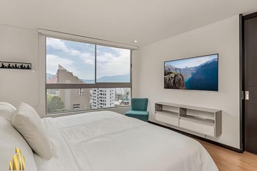 Postel nebo postele na pokoji v ubytování Life 1202 - Pleasant Apt in Poblado with AC