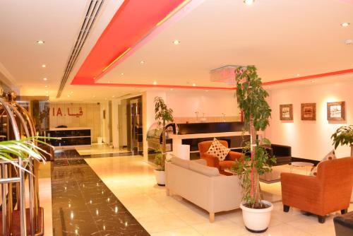 a lobby with potted plants in a building at فيا للشقق المخدومة in Al Khobar