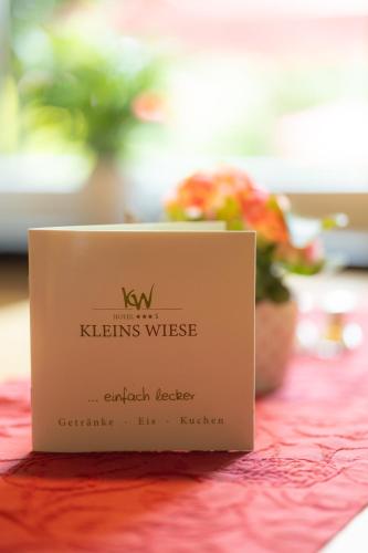a sign sitting on top of a table at Hotel Kleins Wiese in Schmallenberg