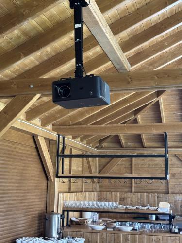 a speaker hanging from the ceiling of a room at Apartamenty pod Dębami - noclegi Beskid Niski in Odrzechowa