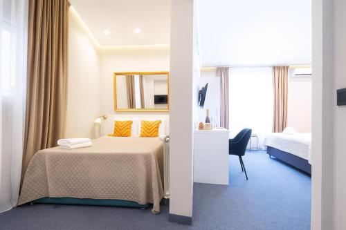 Ένα ή περισσότερα κρεβάτια σε δωμάτιο στο Central Belgrade Apartments