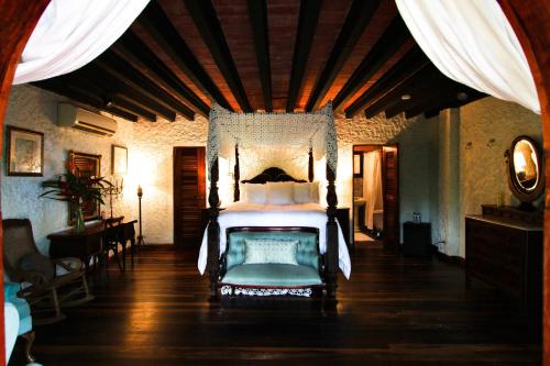 a bedroom with a large bed in a room at Hacienda Siesta Alegre in Rio Grande