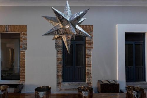a large star hanging on a wall next to a door at Palacio Julio Hotel in Puebla