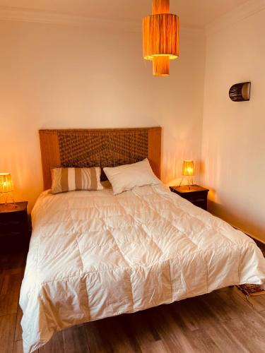 Una cama o camas en una habitación de El MELK MANSOUR