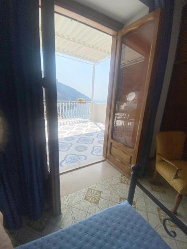 a view of a room with a door and a balcony at Casa Donna Concetta in Positano