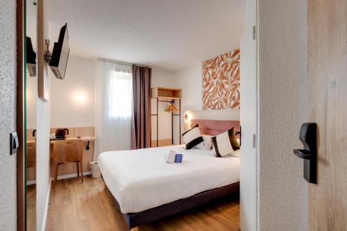 Ένα ή περισσότερα κρεβάτια σε δωμάτιο στο Sure Hotel by Best Western Valence Nord