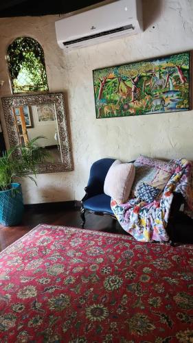 a bedroom with a bed and a mirror at Hacienda Siesta Alegre in Rio Grande